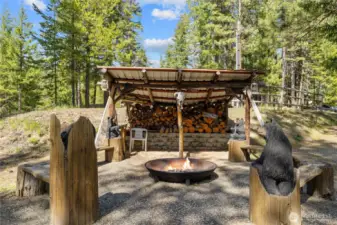 Awesome firepit with covered wood storage