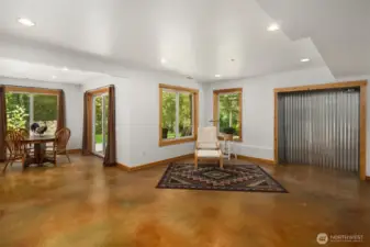 Lower level living room with dedicated space for a fireplace.