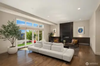 We love this custom metal fireplace.  It is a beautiful artisan statement.  Wonderful french doors let you enjoy Kirkland's mosst beloved and friendly street.
