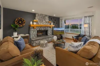 Living room with stone fireplace.
