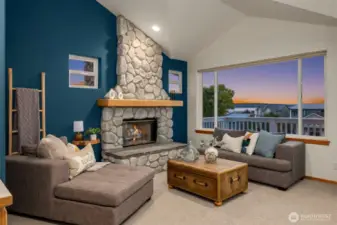 Primary en suite retreat featuring a private living area, coffee bar, and sweeping water views—perfect for quiet mornings or relaxing evenings