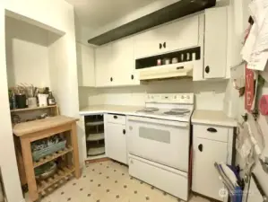 Kitchen has lots of cupboards for storage!