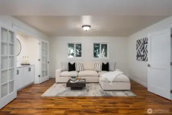 Engineered hardwoods continue downstairs.