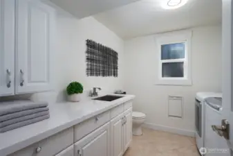 Laundry and half bath, this space is already plumbed for a shower.