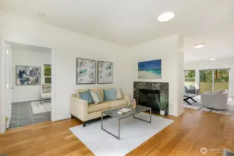 Entry includes sitting room with fireplace.