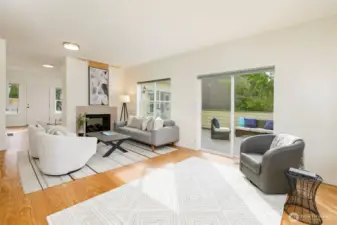 Spacious living room adjoins large deck.