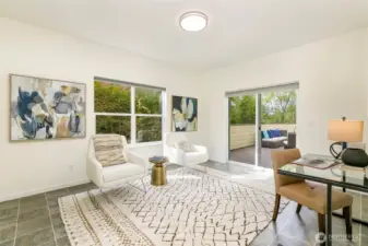 Den with slider to spacious deck.