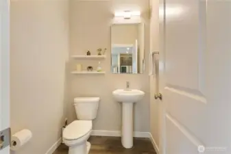 Powder room on the second floor next to the stairs.