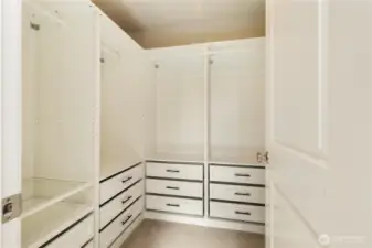 Spacious custom walk-in closet in the primary bedroom
