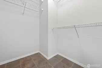 Primary bedroom walk-in closet.