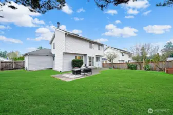 Gate opens for vehicle access to the rear yard.
