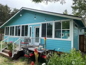 Rear view of the home with an Enclosed Rear Deck.