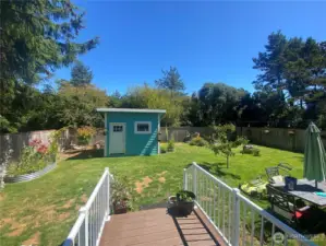 Enjoy the outdoors in this fully-fenced backyard with an 8x12 storage shed.