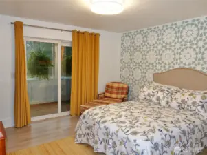 Master Bedroom w/ a slider to the enclosed rear deck.