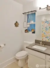 Master Bathroom w/ tile floors and shower.