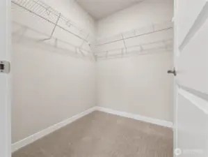 Primary bedroom has walk-in closet off the bedroom, not inside the bathroom.  Actual home is under construction and materials, colors, and finishes will vary. See site agent for details.