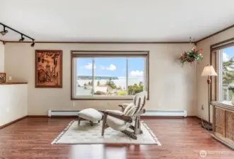 Living room with views of Olympic Mountains, Protection Island, Diamond Point and San Juans.