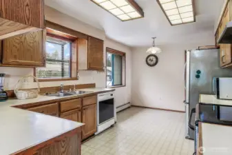 Bay window over kitchen sink, perfect for plants and breakfast nook