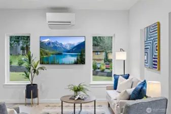Main living area with high ceilings, tons of windows and loads of light.