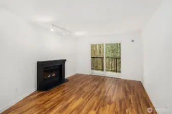 Gorgeous hard surface flooring throughout and cozy wood burning fireplace!