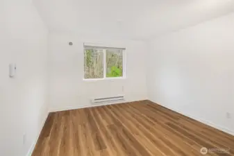 One of the two roomy bedrooms overlooks the peaceful preserved woodland.  New hard surface LVT flooring.