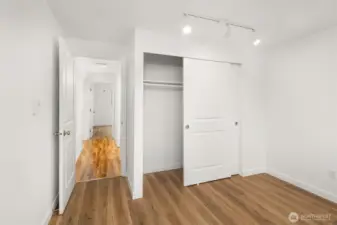 The second of two bedrooms includes a large closet for storage.