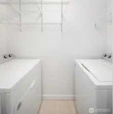 Just off the bathroom is a separate space for new washer and dryer plus storage.  All new appliances.