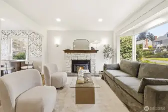 Large windows, warm tones, and a statement fireplace