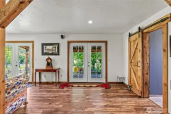 Two sets of french doors allow copious natural light.