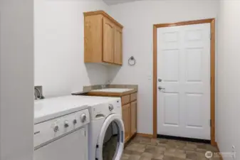 Washer and dryer stay. Plenty of room for more shelving if desired.