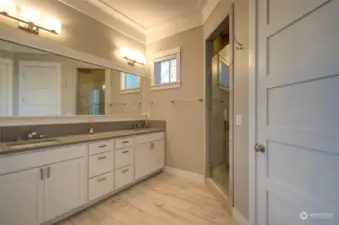 The primary bath has double vanities, a large walk in shower.....