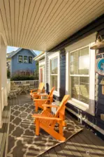 Beyond the covered porch is an open patio with pavers for extra seating.