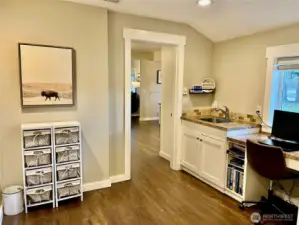 Utility room with direct access to the kitchen, creating a great flow and making daily tasks more convenient in this thoughtfully designed floor plan.