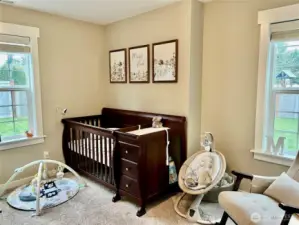 The second bedroom, currently used as a nursery, is spacious and has plenty of room to accommodate all your essentials and more.