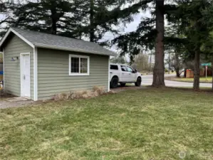 The house, yard, fence, carport, and 1-car garage all complement each other with a cohesive country style, creating a charming and inviting appeal throughout the property.