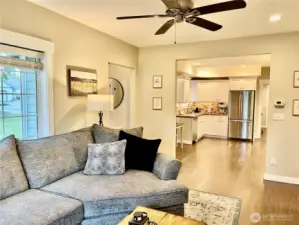 Open floor plan with the living room seamlessly flowing into the dining room and kitchen. The space feels larger than its square footage