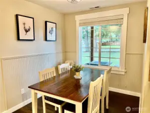 Country-style living with a spacious dining room that flows effortlessly into the kitchen, creating an easy, open layout perfect for daily living and entertaining.