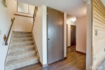 Stairs to the lower level, where 2 additional bedrooms, a full bath, bonus room, utility room, and office can be enjoyed.