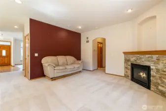 Open concept living room area with gas fireplace!
