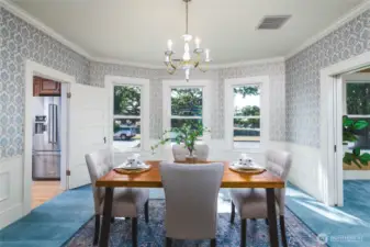 Gorgeous formal dining room with French pocket doors to separate the space if desired. High end carpets are covering wood floors beneath - according to the Seller (Buyer to verify of course!)
