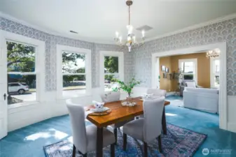 Another view of the formal dining room opening to the kitchen and living room and family room/den.