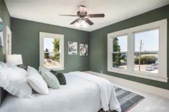 Generous primary bedroom with views of the Guemes Channel, 2 walk-in closets and cozy high end carpeting.