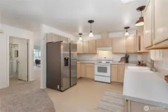 Large kitchen w/newer fridge & tons of cabinets.