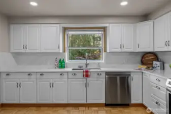 Kitchen with New White Quartz Counter Top and Full Back Splash and Stainless Steel Appliances