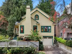 Expanded to incorporate the 3rd level, this reimagined American Foursquare sits gracefully among the trees, its classic lines and green-trimmed windows echoing historic Leschi charm.