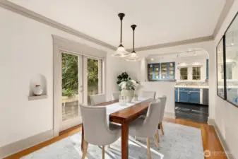 Gorgeous, elegant and welcoming!  The dining room is located between the kitchen and living room, all of which are open to each other.  Perfect for many guests or intimate dinners.