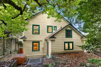 The back patio and garden features mature trees, lush ground cover, and a charming outdoor clay oven—ready for pizza nights or garden gatherings.  This is the most secluded space to enjoy.