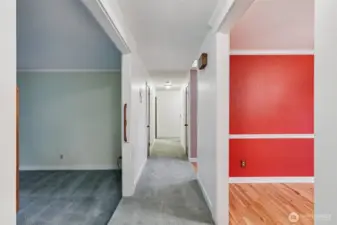 Hallway facing the opposite side of the house, viewed from the kitchen and family room. To the left is the formal living room, and to the right is the dining room .