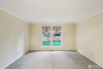 Living room with view of the backyard. Beautiful light!