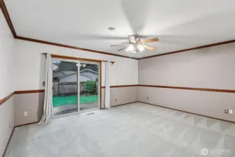 Spacious primary bedroom. Also has access to the beautiful backyard.